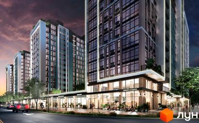 Високоповерховий будинок ЖК Феофанія City з панорамними вікнами та комерційними приміщеннями на першому поверсі. На прибудинковій території розташовані тротуари та зелені насадження.