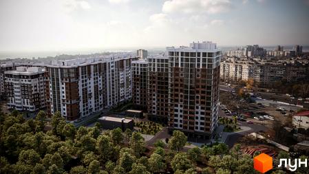 Житловий комплекс Золота Ера з висотними будинками з білими та коричневими фасадами. Навколо будівель зелені насадження та прибудинкова територія.