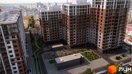 Житловий комплекс Золота Ера з фасадами з цегли та великими вікнами. На території комплексу є дитячий майданчик та зелені насадження.