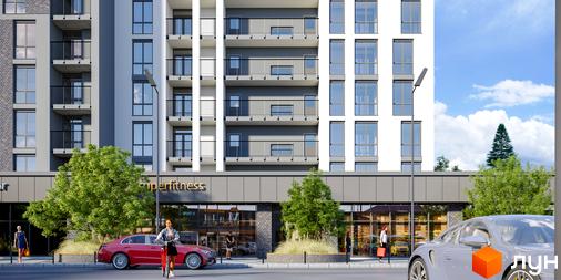 Зовнішній вигляд житлового комплексу Щасливий Grand з фасадами, балконами та вікнами, а також прибудинковою територією з деревами та автомобілями.