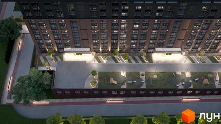 Житловий комплекс Chicago: вид зверху на цегляний будинок з великими вікнами та прибудинкову територію з дитячим майданчиком і зеленими насадженнями.