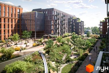 Житловий комплекс AVANT PARK з цегляними фасадами та зеленою прибудинковою територією з дитячим майданчиком та місцями для відпочинку.