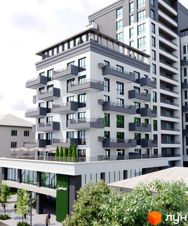 Багатоповерховий будинок ЖК Boulevard з балконами та панорамними вікнами. На території будинку є зелені насадження та зона відпочинку.
