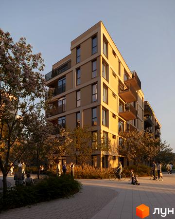 Житловий комплекс Avalon Magnolia з фасадом світло-бежевого кольору та балконами. Навколо комплексу зелена зона з деревами та людьми, що відпочивають.