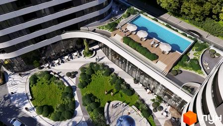 Житловий комплекс Липські вежі з вигнутими фасадами та великими вікнами. На даху розташований басейн, а на території – зелені зони та кафе.