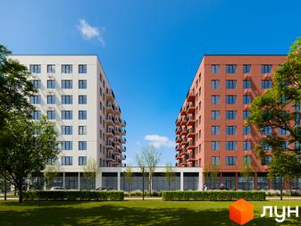 Зовнішній вигляд новобудови ЖК City House з цегляним фасадом та білим фасадом, зелена прибудинкова територія з деревами та газоном.