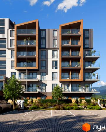 Житловий комплекс GRONO Family Residence з дерев'яними елементами та скляними балконами на фоні блакитного неба. Перед будинком розташована парковка та зелені насадження.